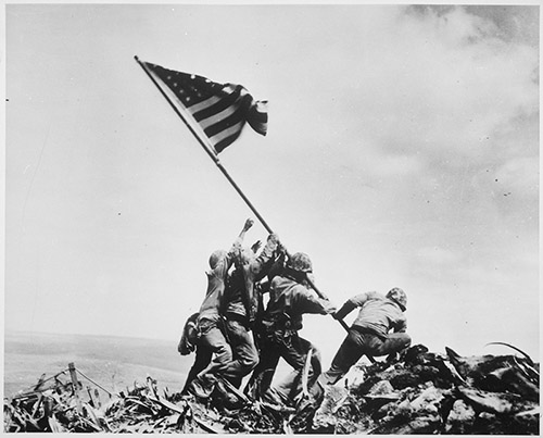 Joe Rosenthal, U.S. Marines of the 28th Regiment, 5th Division, raise the American flag atop Mt. Suribachi, Iwo Jima, on Feb. 23, 1945 © National Archives and Records
Administration / DR.